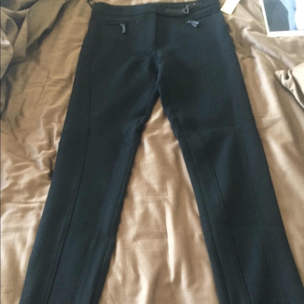 Pants with seaming and side zippers at ankle